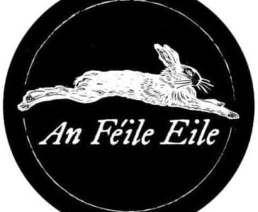 A black circular logo featuring a white illustration of a leaping hare above the text "An Féile Eile" in a serif font.